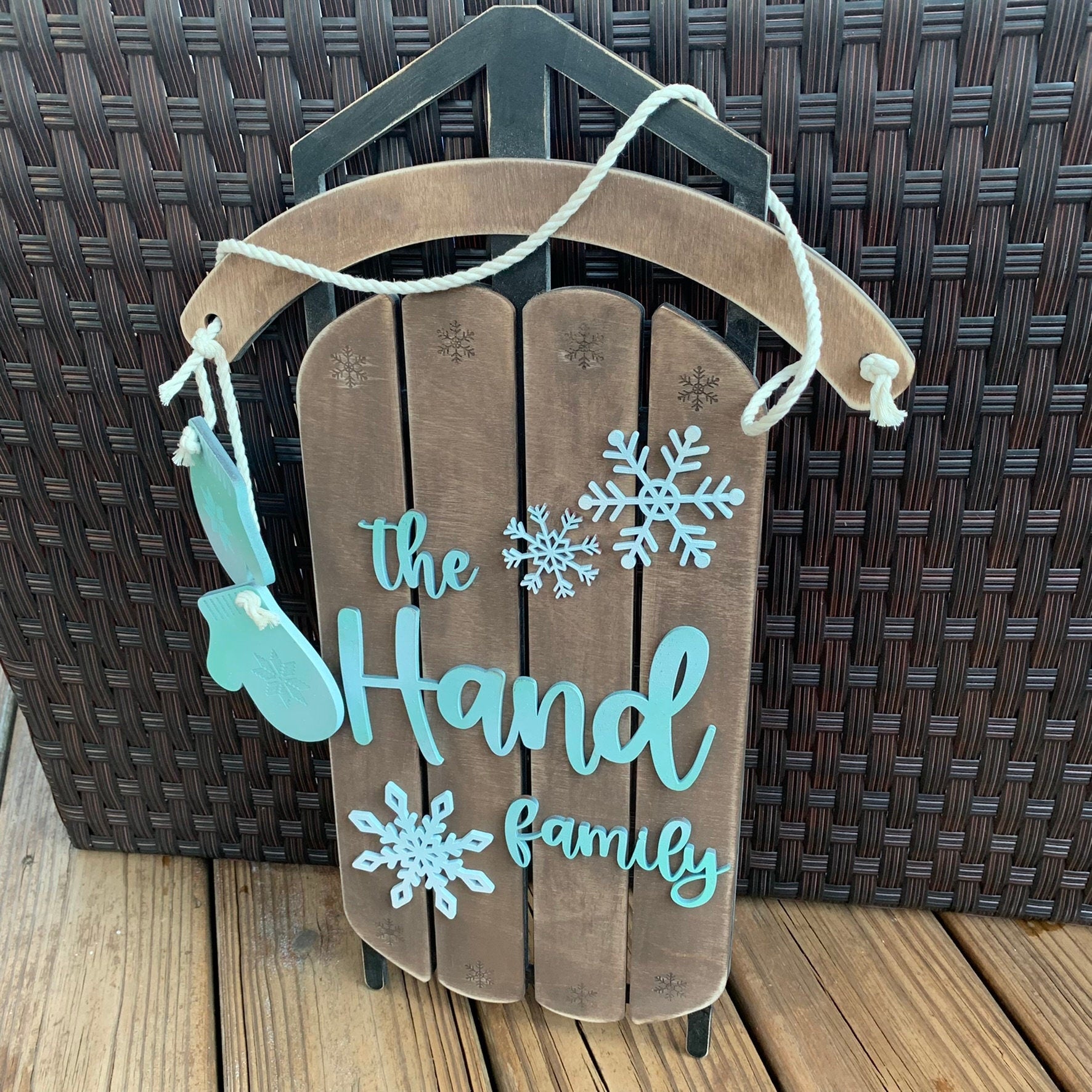 Snowflakes and Mittens Family Name Laser Cut Wood Sled Sign